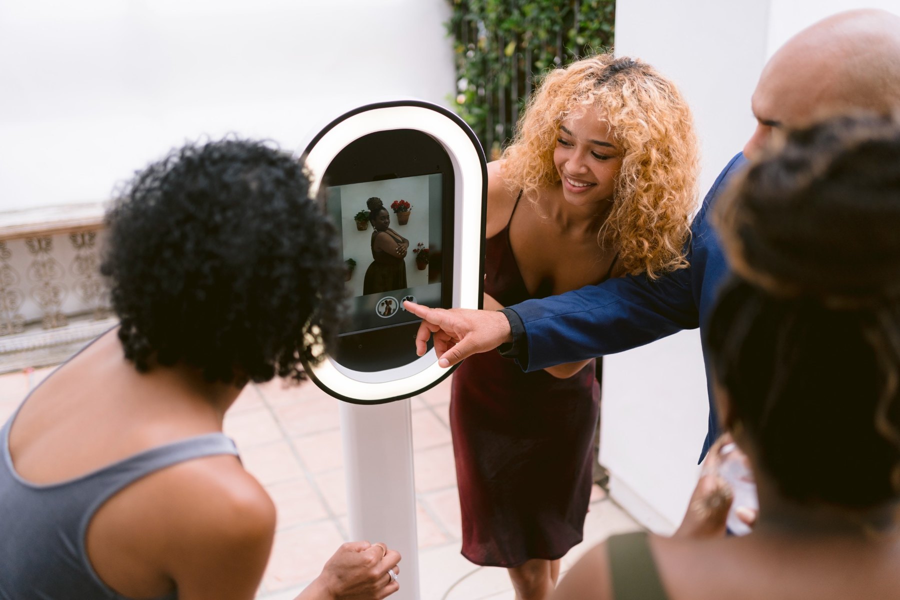 Group sharing a photo at the booth screen